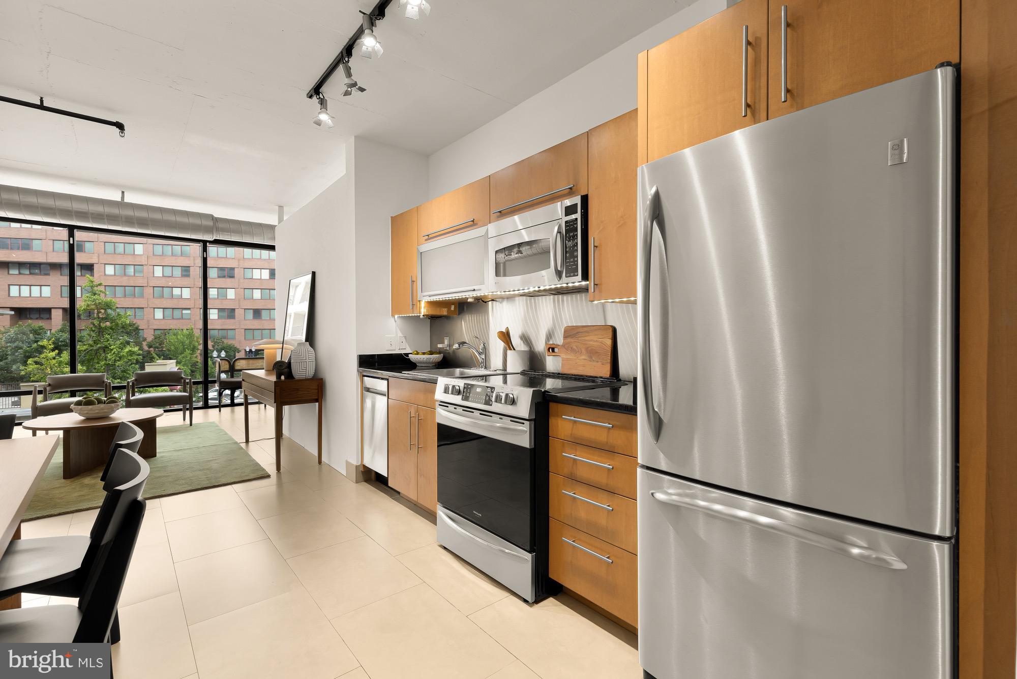 1133 14th Street Northwest, Unit 308 Washington, DC 20005 - Photo 11 of 34 Modern kitchen with sleek finishes and light.