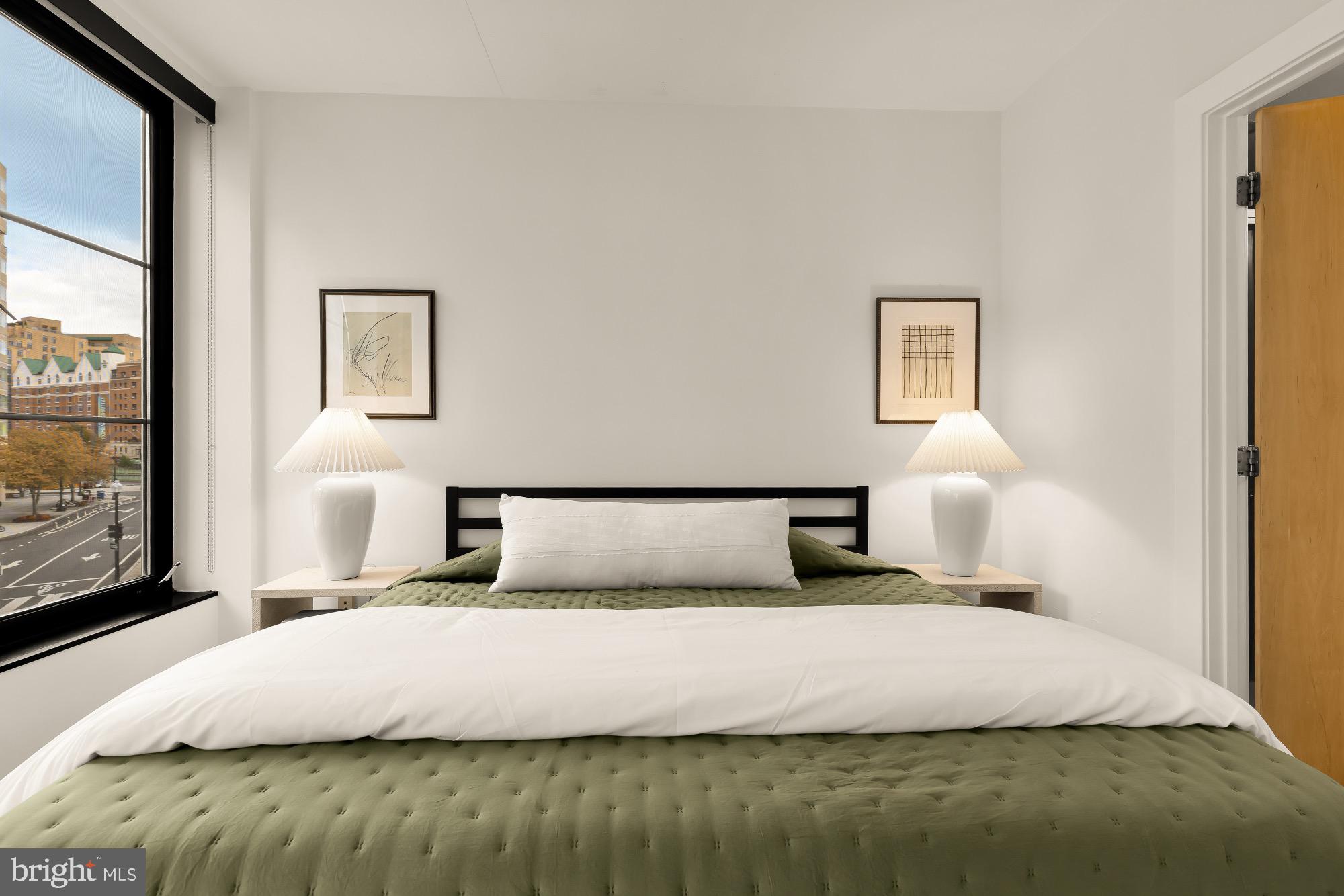 1133 14th Street Northwest, Unit 308 Washington, DC 20005 - Photo 14 of 34 Serene bedroom with city views and light.