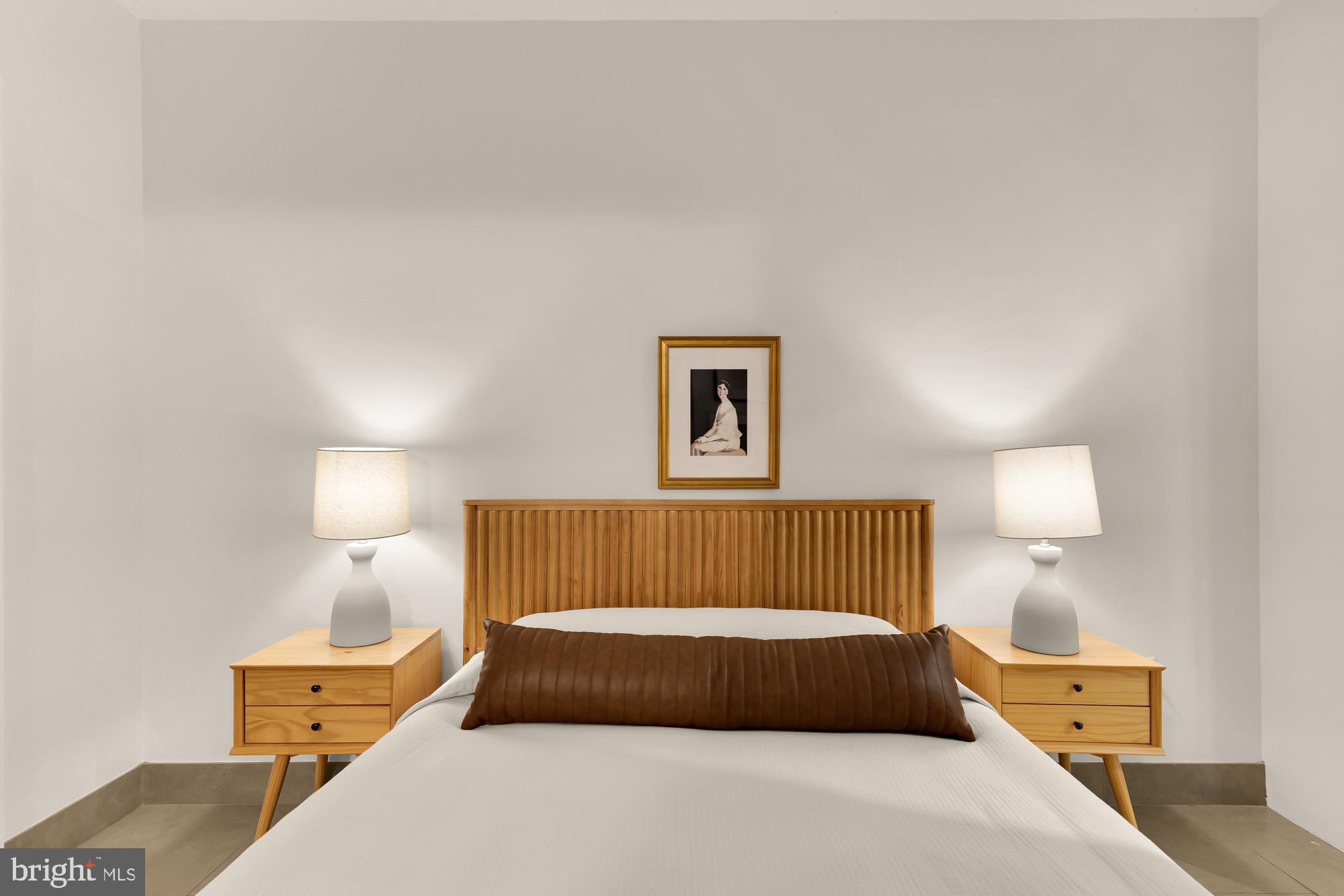 1133 14th Street Northwest, Unit 308 Washington, DC 20005 - Photo 20 of 34 Serene bedroom with modern elegance.