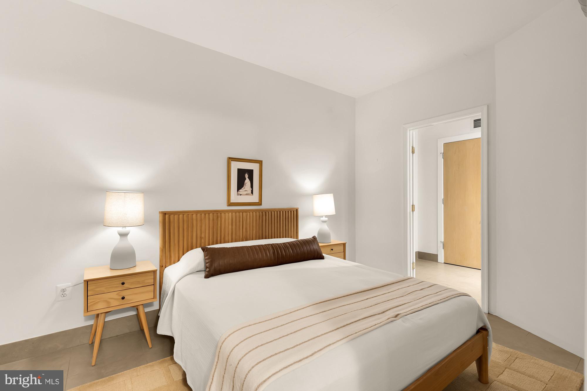 1133 14th Street Northwest, Unit 308 Washington, DC 20005 - Photo 21 of 34 Serene bedroom with modern elegance.