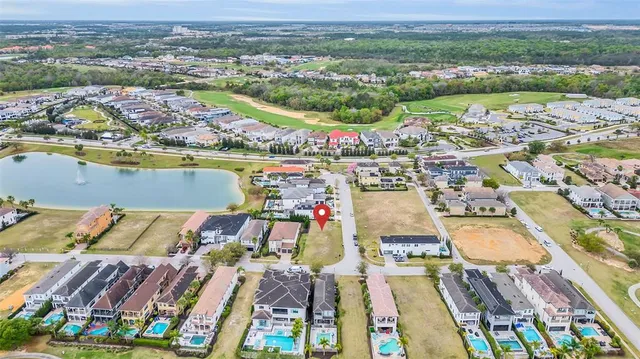 an aerial view of residential houses with outdoor space