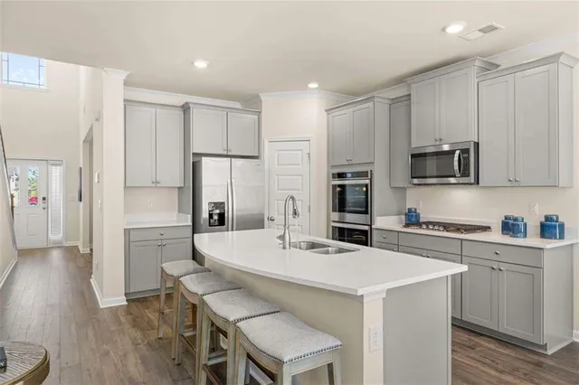 a bathroom with a double vanity sink mirror and shower