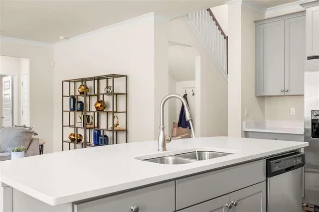 a dining room with furniture a chandelier and wooden floor