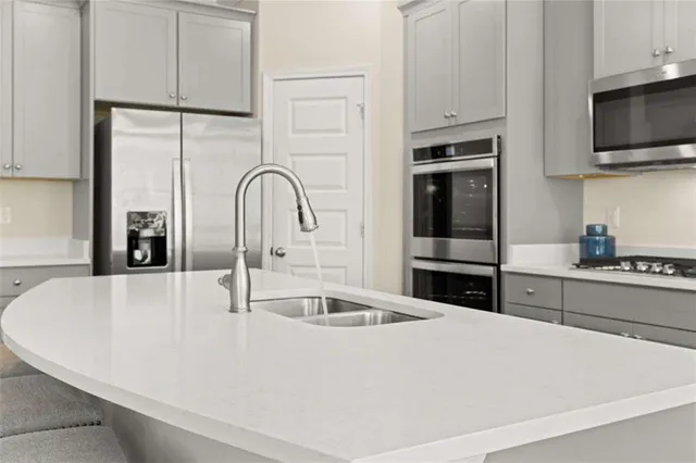 a living room with furniture and kitchen view