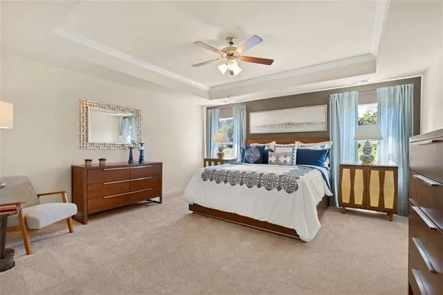 a view of a dining room with furniture and a window