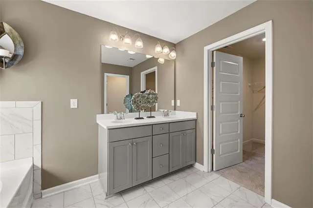 a bedroom with a bed and painting on the wall