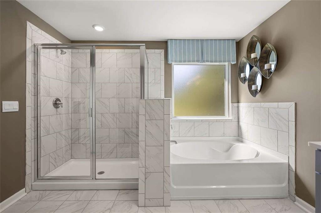 13632 Whitman Lane Covington, GA 30014 - Photo 25 of 53 a bathroom with a shower and a bathtub