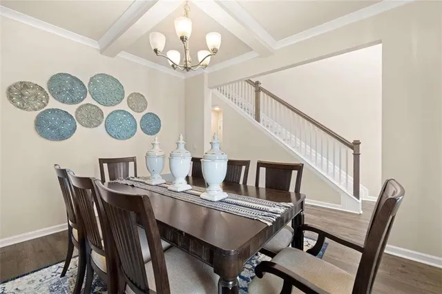 a living room with furniture a wooden floor and a sink
