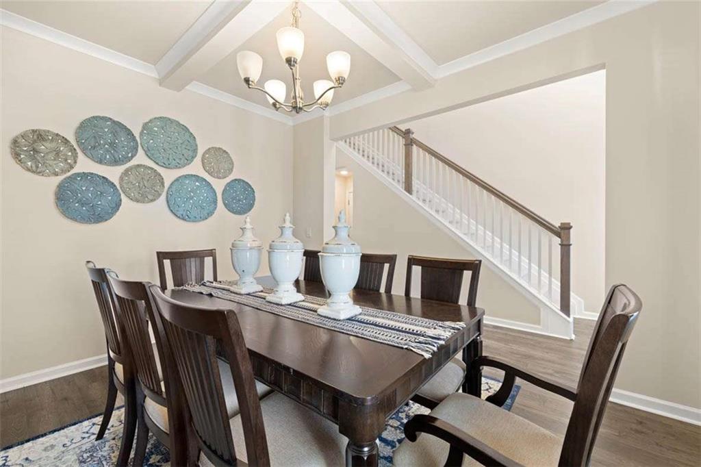 13632 Whitman Lane Covington, GA 30014 - Photo 6 of 53 a view of a dining room with furniture and wooden floor