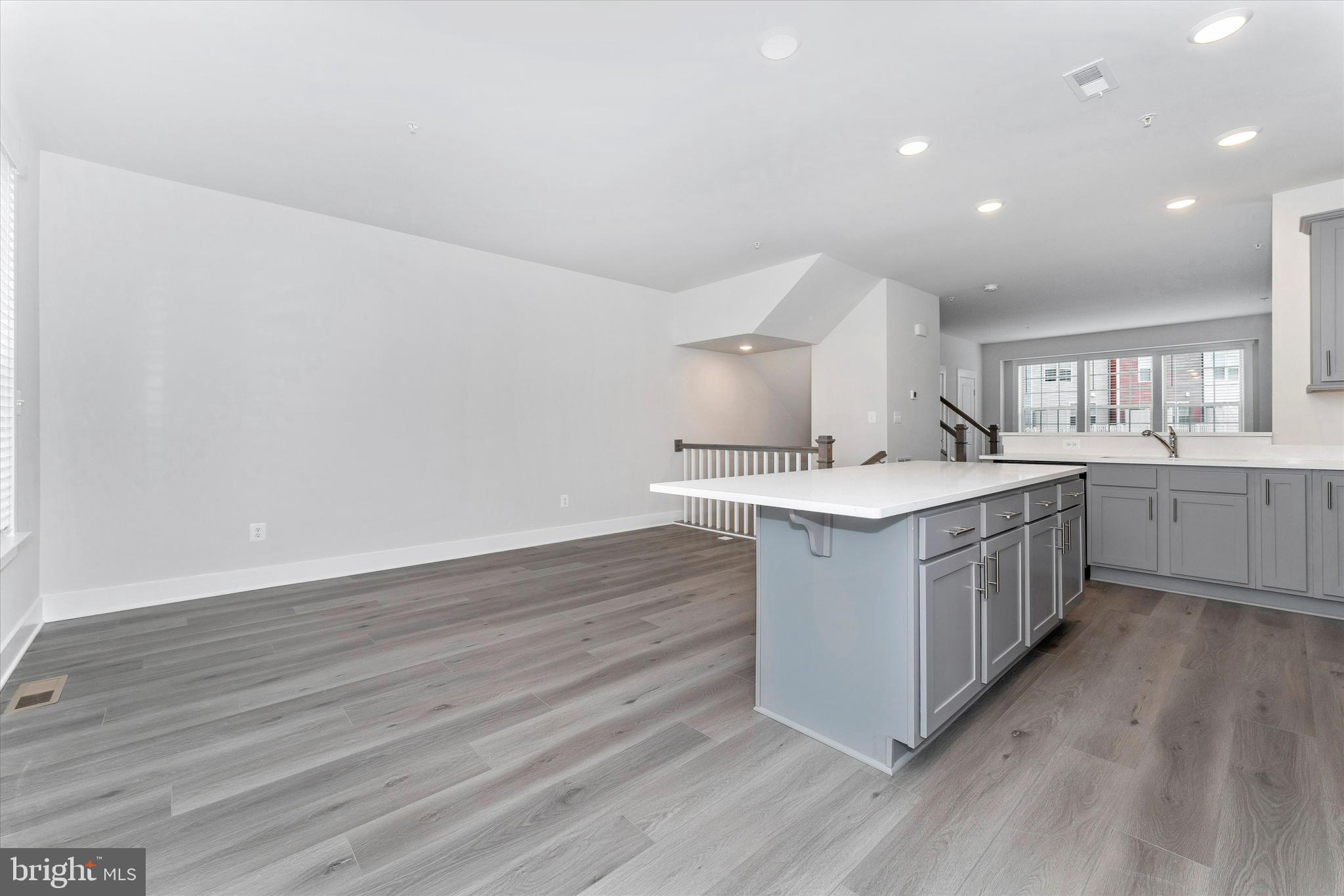 2923 Osprey Way Frederick, MD 21701 - Photo 16 of 42 a kitchen with a sink cabinets and wooden floor