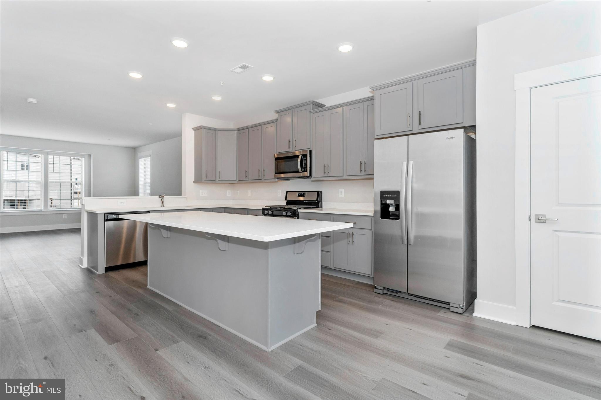 2923 Osprey Way Frederick, MD 21701 - Photo 17 of 42 a kitchen with a refrigerator a sink and cabinets