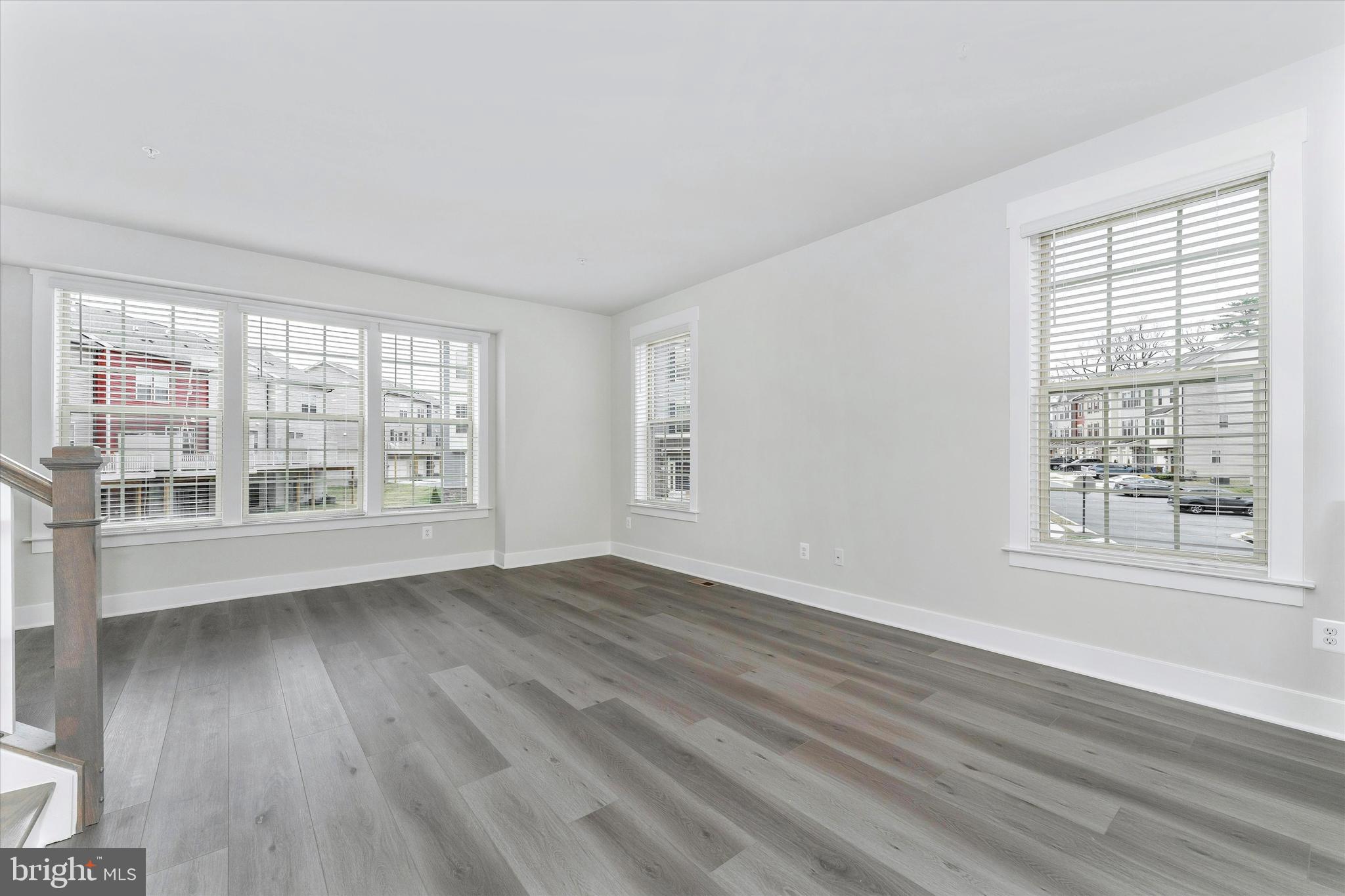2923 Osprey Way Frederick, MD 21701 - Photo 22 of 42 a view of an empty room with wooden floor and a window