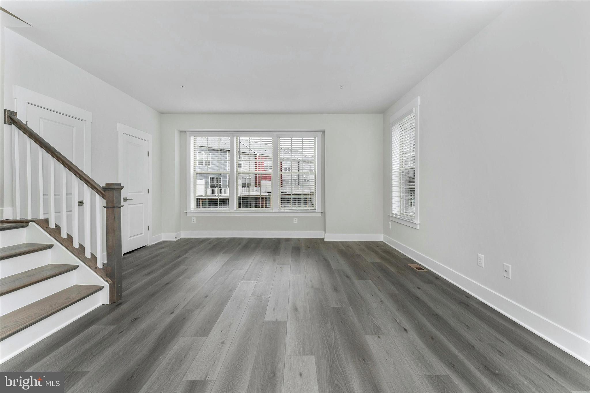 2923 Osprey Way Frederick, MD 21701 - Photo 23 of 42 wooden floor in an empty room with a window