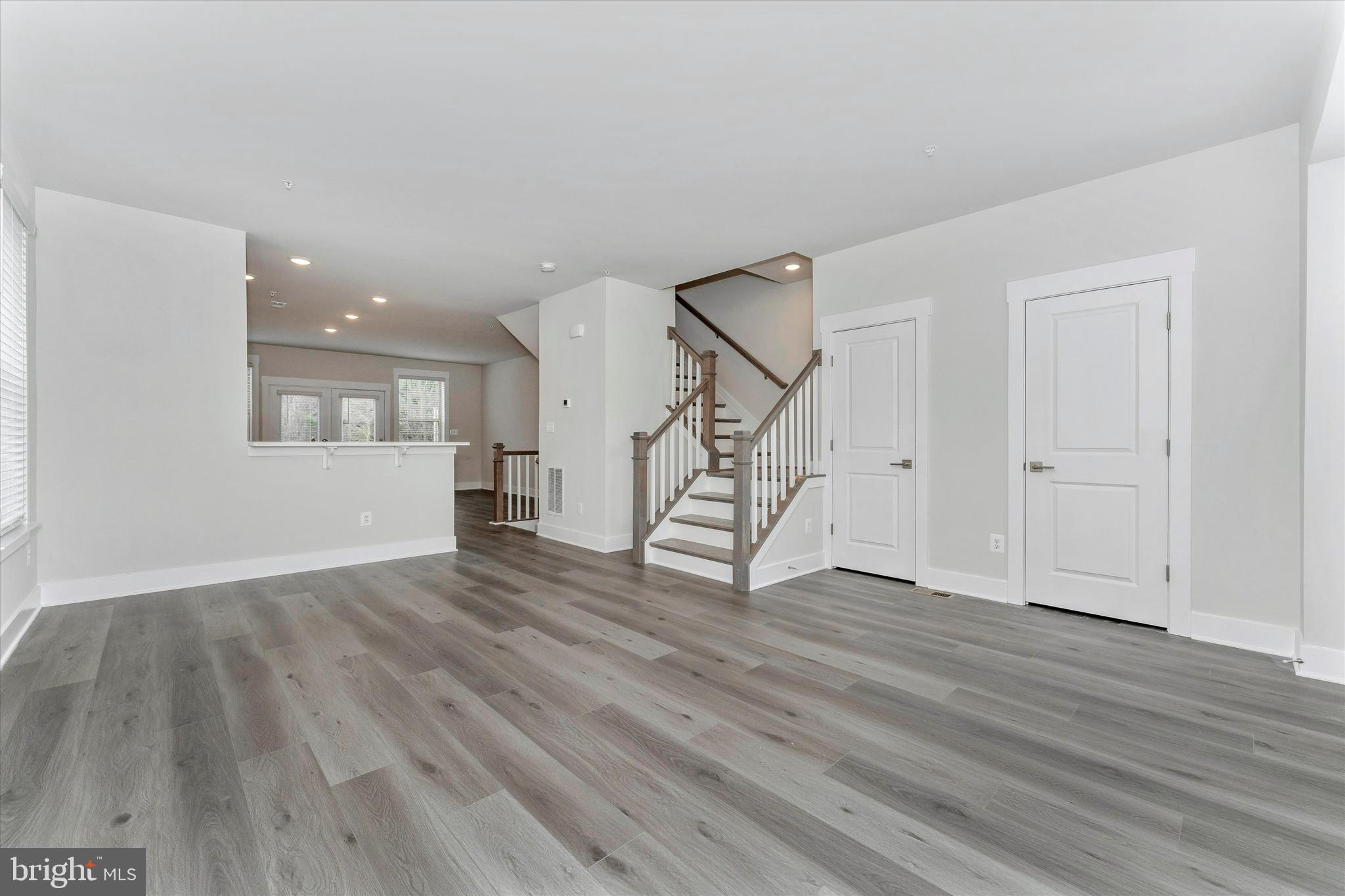 2923 Osprey Way Frederick, MD 21701 - Photo 26 of 42 a view of an empty room with wooden floor and a window