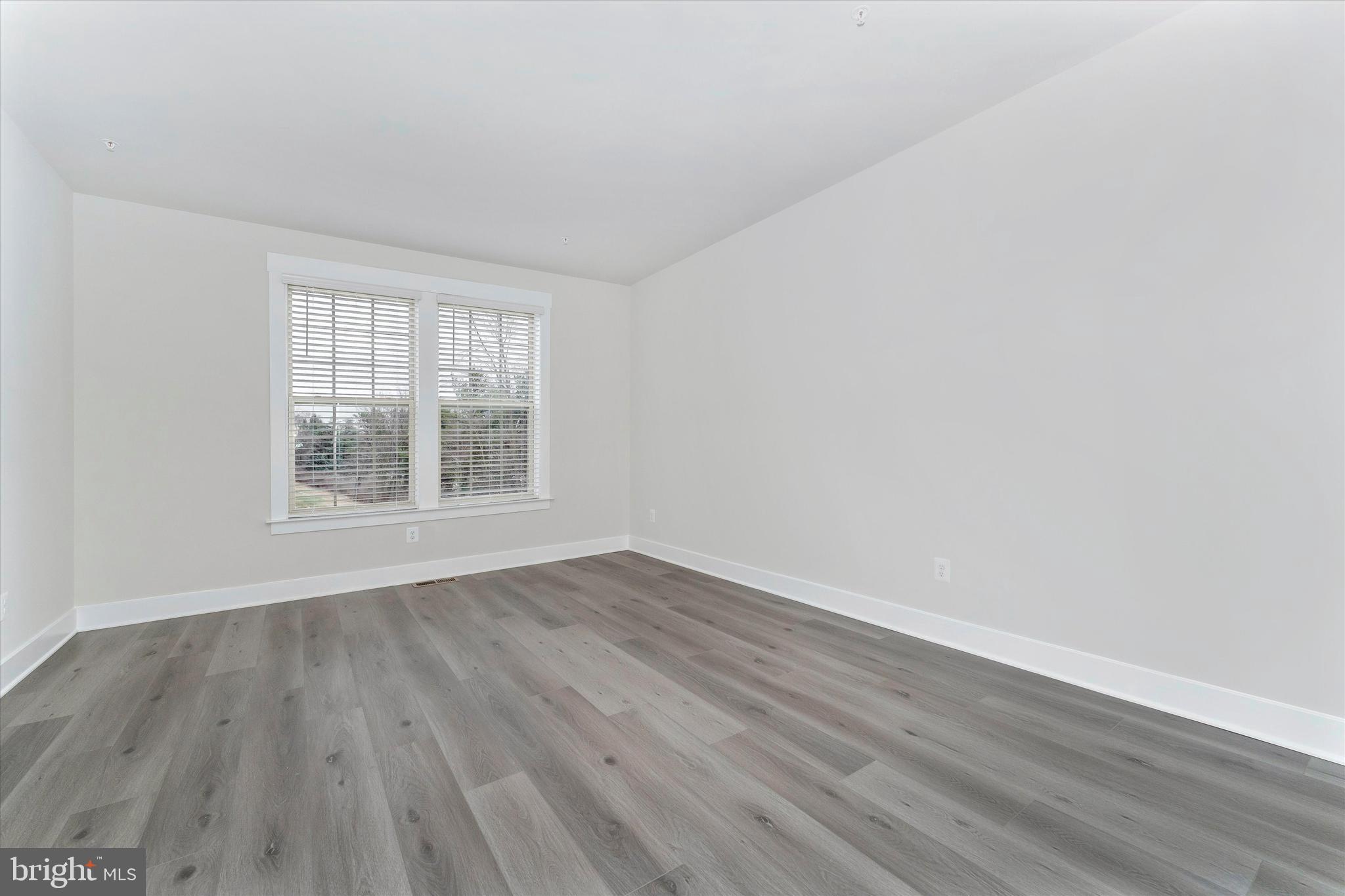 2923 Osprey Way Frederick, MD 21701 - Photo 30 of 42 wooden floor in an empty room with a window