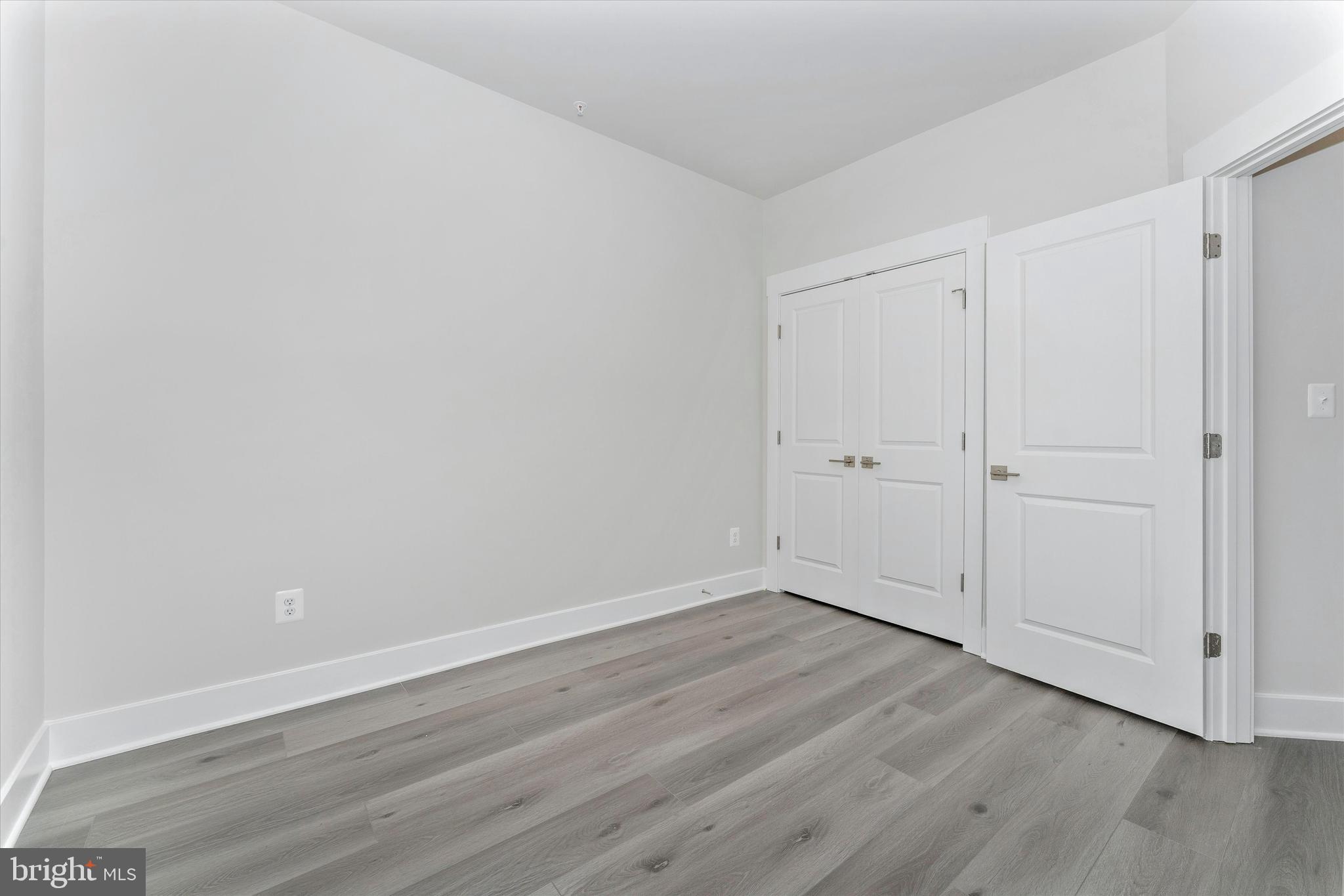 2923 Osprey Way Frederick, MD 21701 - Photo 37 of 42 a view of an empty room with wooden floor