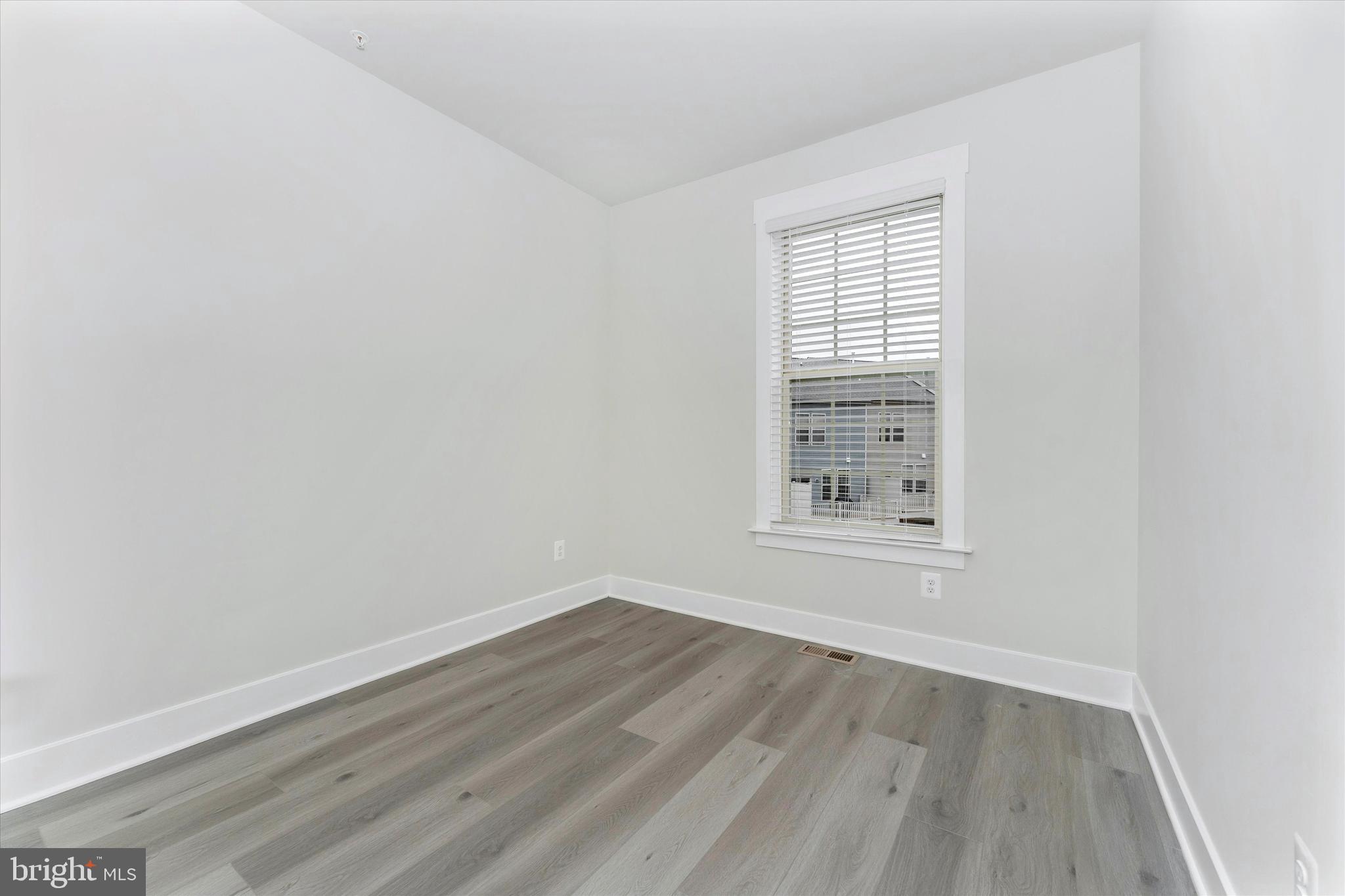 2923 Osprey Way Frederick, MD 21701 - Photo 38 of 42 wooden floor in an empty room with a window