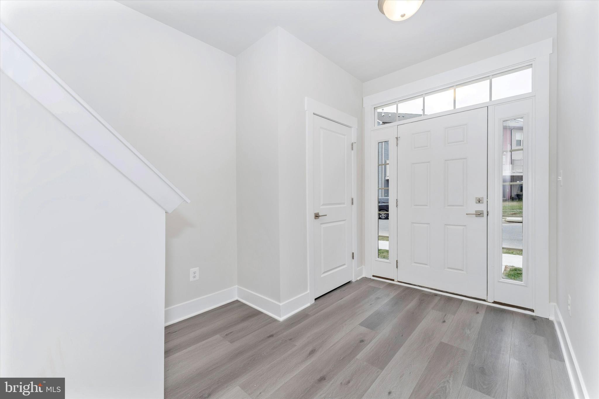 2923 Osprey Way Frederick, MD 21701 - Photo 6 of 42 an empty room with wooden floor