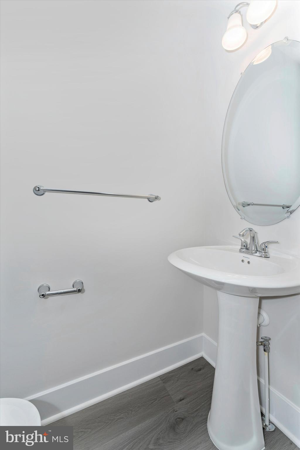 2923 Osprey Way Frederick, MD 21701 - Photo 8 of 42 a bathroom with a sink and mirror