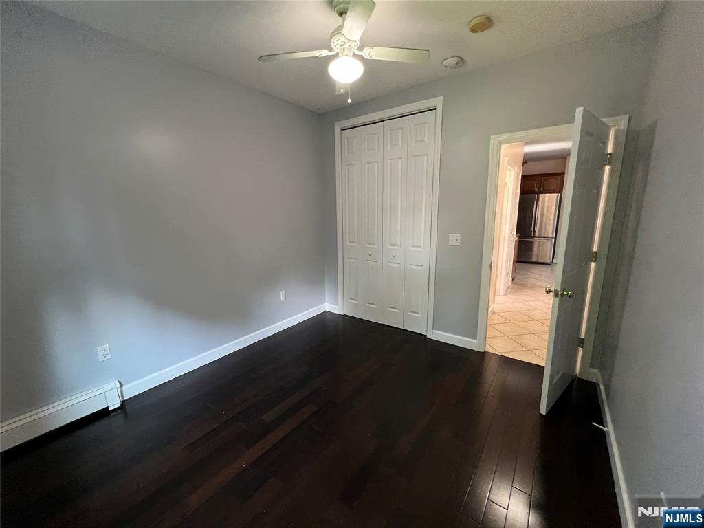 68 Liberty Street, Unit 1 Lodi, NJ 07644 - Photo 11 of 23 wooden floor in an empty room with a window