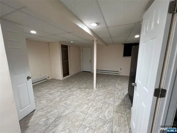 a view of a kitchen with refrigerator and microwave
