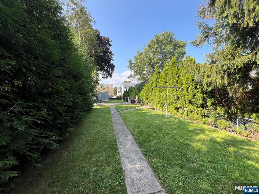 68 Liberty Street, Unit 1 Lodi, NJ 07644 - Photo 23 of 23 a view of a yard with plants