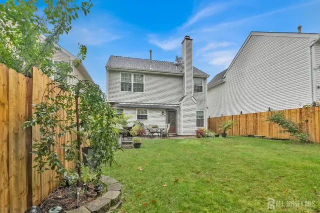 a view of a house with a back yard