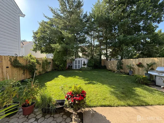 a view of a flower garden with a yard