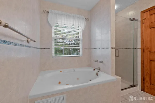 a white bath tub sitting next to a window