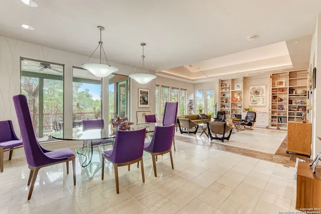 a view of a dining room with furniture window and outside view
