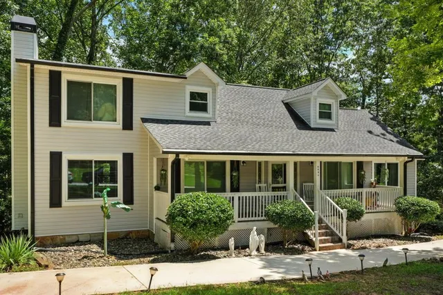 a front view of a house with garden