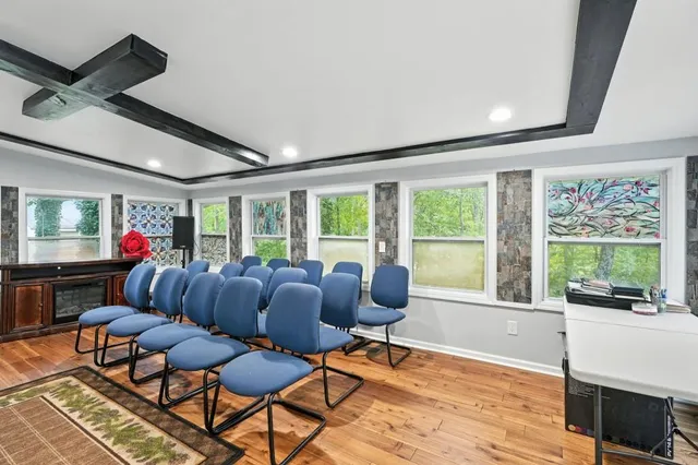 a living room with furniture and a large window