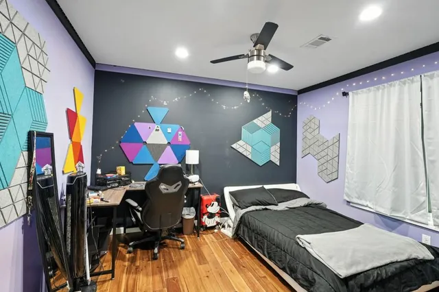 a bedroom with furniture and a chandelier