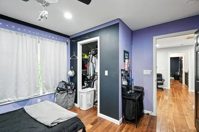a living room with furniture rug and wooden floor