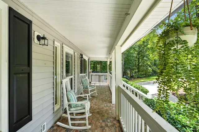 a view of a balcony with chairs