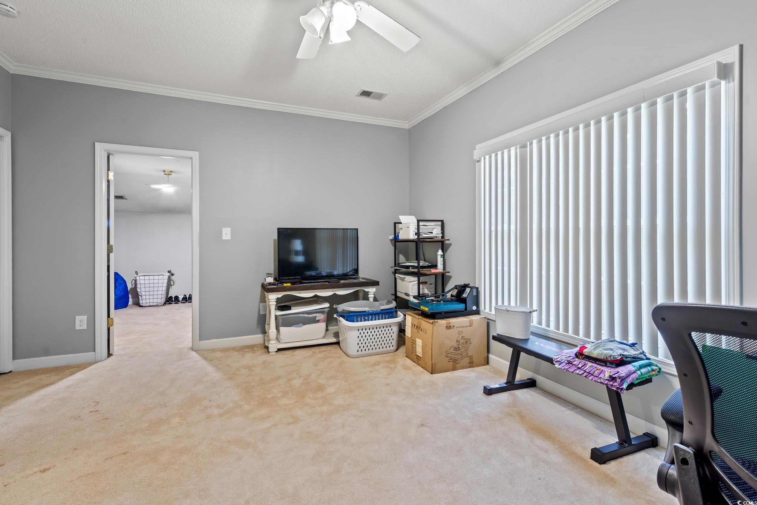 509 Shellbank Drive, Unit B Longs, SC 29568 - Photo 18 of 33 Office area with ornamental molding, carpet, and ceiling fan