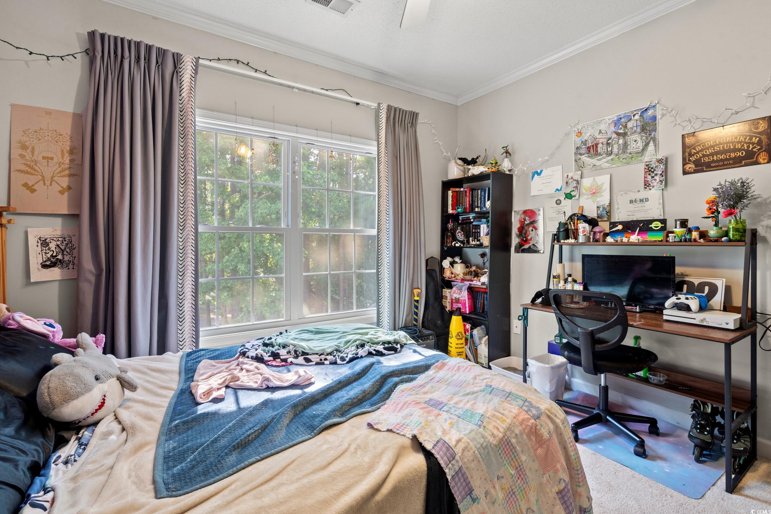 509 Shellbank Drive, Unit B Longs, SC 29568 - Photo 28 of 33 Carpeted bedroom featuring crown molding and a ceiling fan