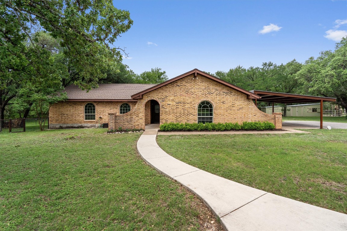 203 Serenada Drive Georgetown, TX 78628 - Photo 1 of 1 a view of a house with a yard
