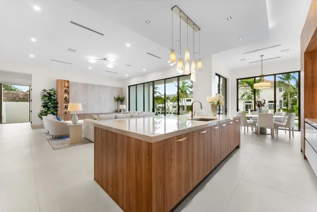 a bathroom with a sink mirror and shower