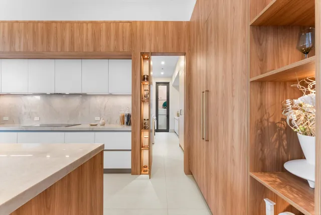 a spacious bedroom with a large bed and a large window