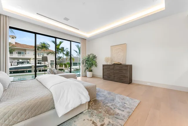 a view of a lake with boats and trees in the background