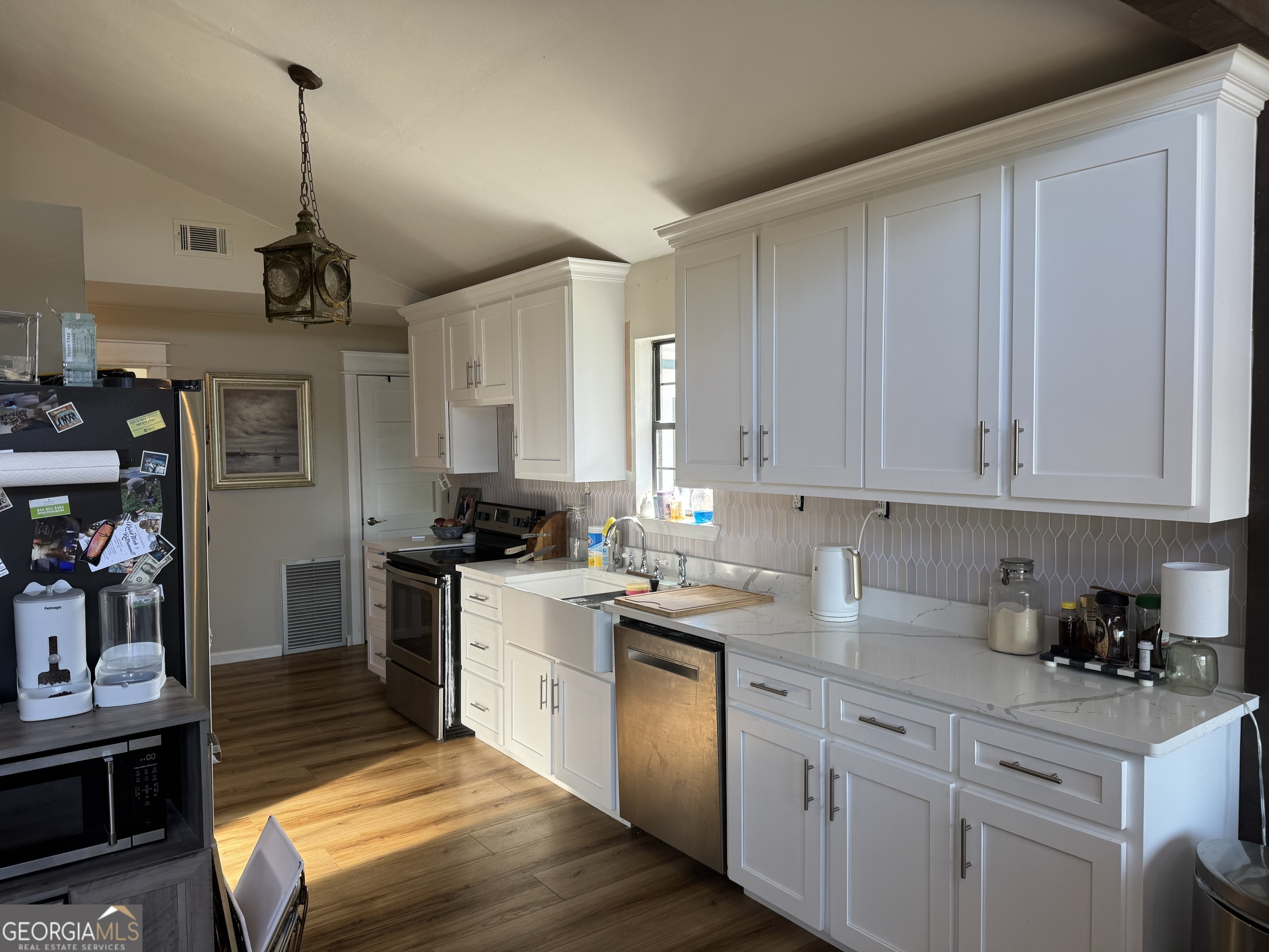 2648 Buck Head Road Baxley, GA 31513 - Photo 8 of 20 a kitchen with a sink stove and cabinets