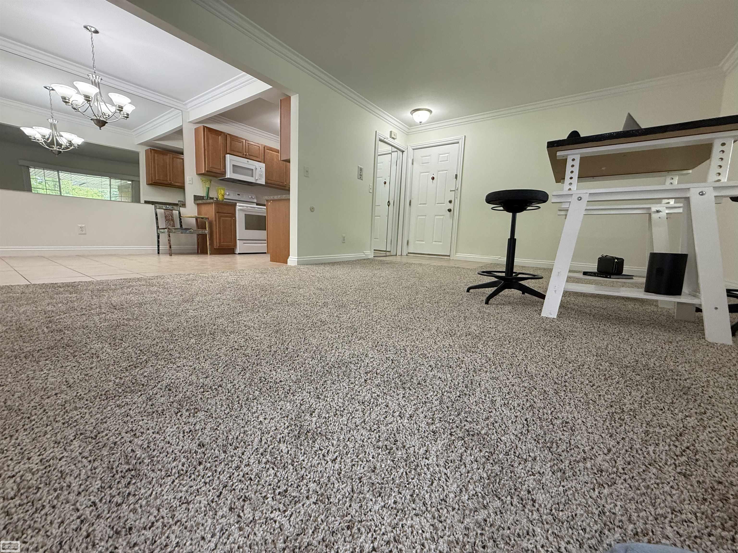 shows foyer, open dining area & layout
