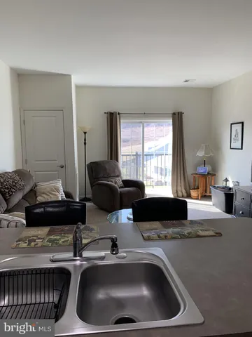 a kitchen with a sink and a stove top oven