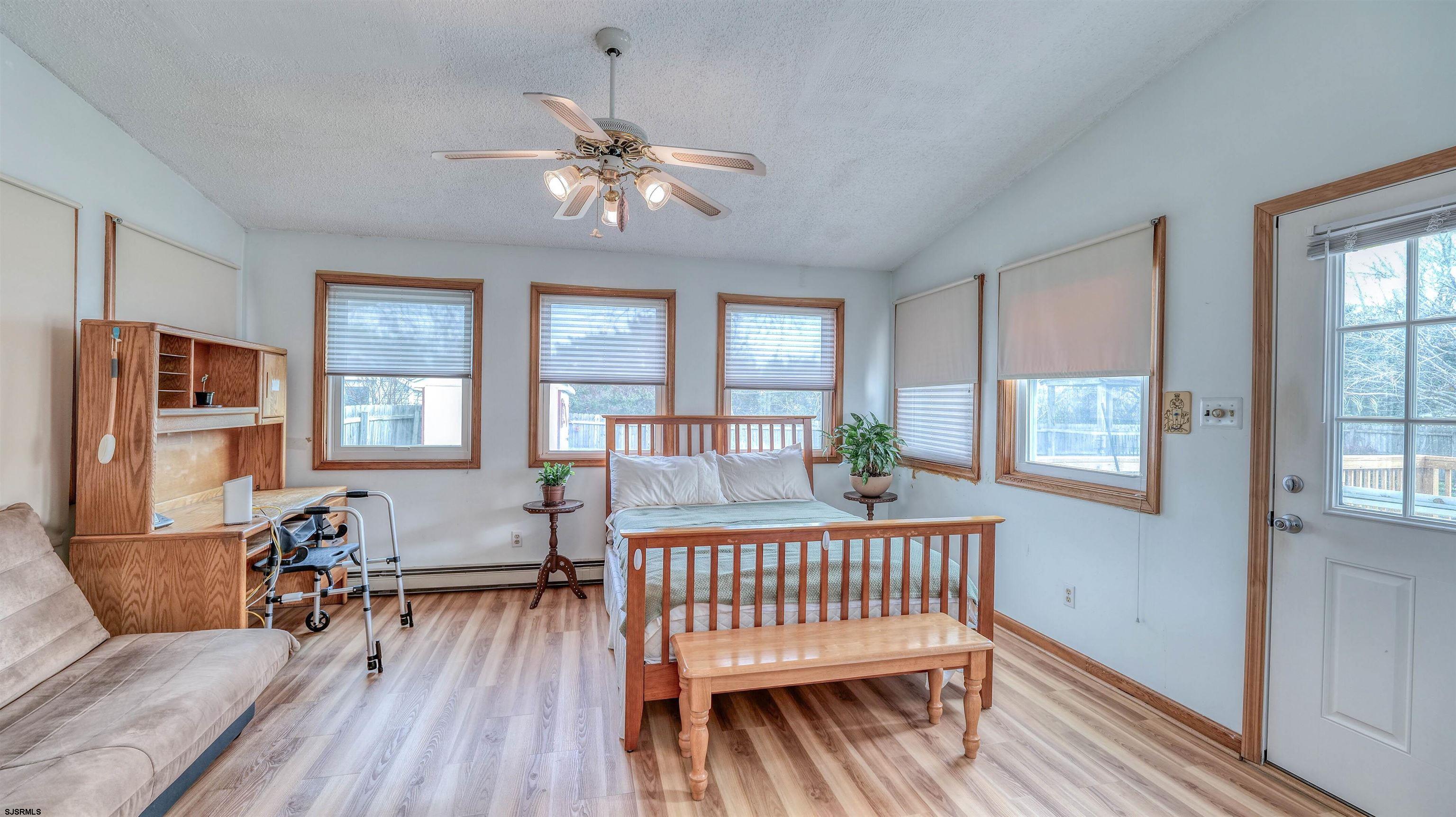715 Lafayette Boulevard Brigantine, NJ 08203 - Photo 13 of 31 a living room with furniture and wooden floor