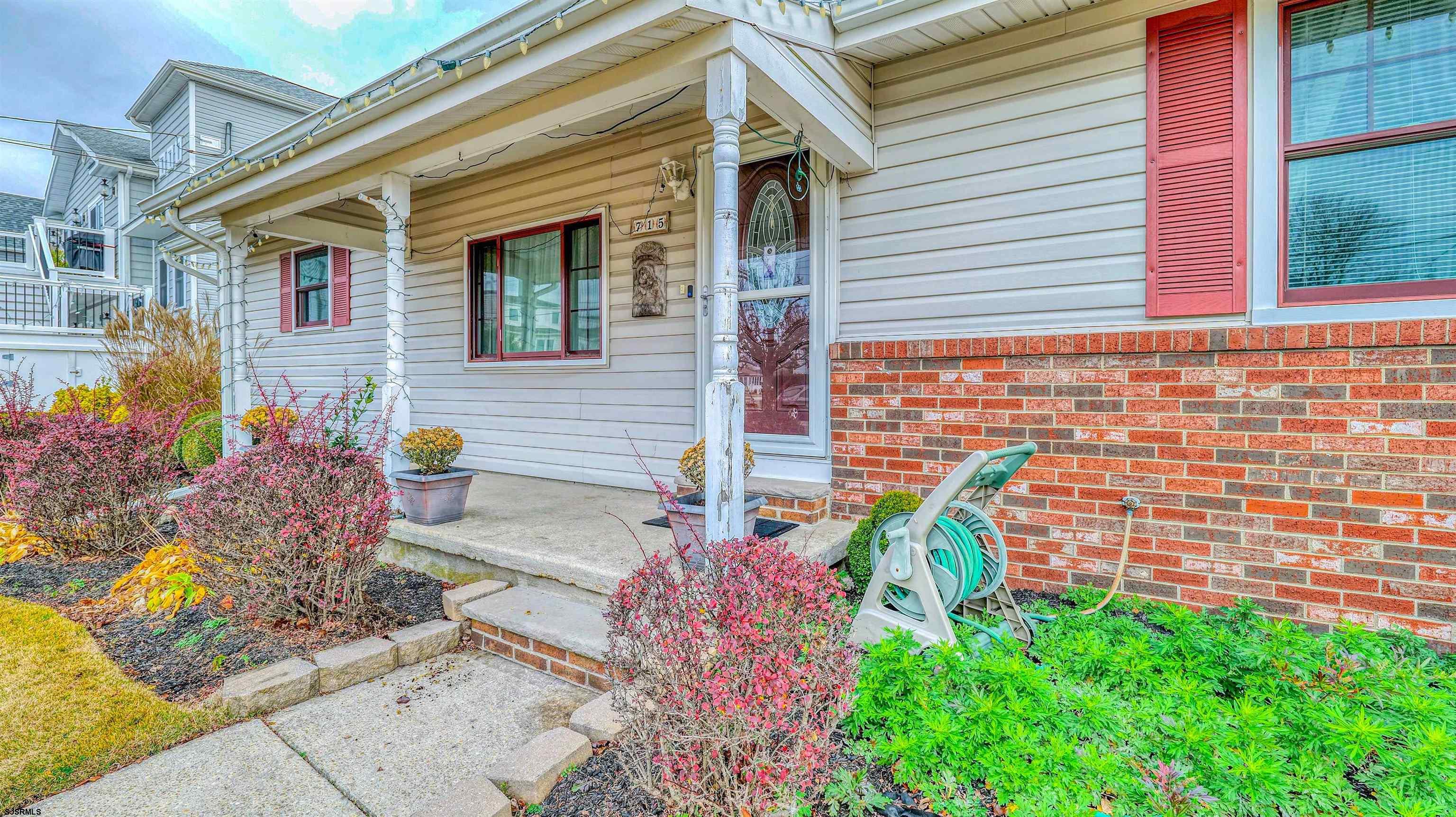 715 Lafayette Boulevard Brigantine, NJ 08203 - Photo 2 of 31 a front view of a house with outdoor space