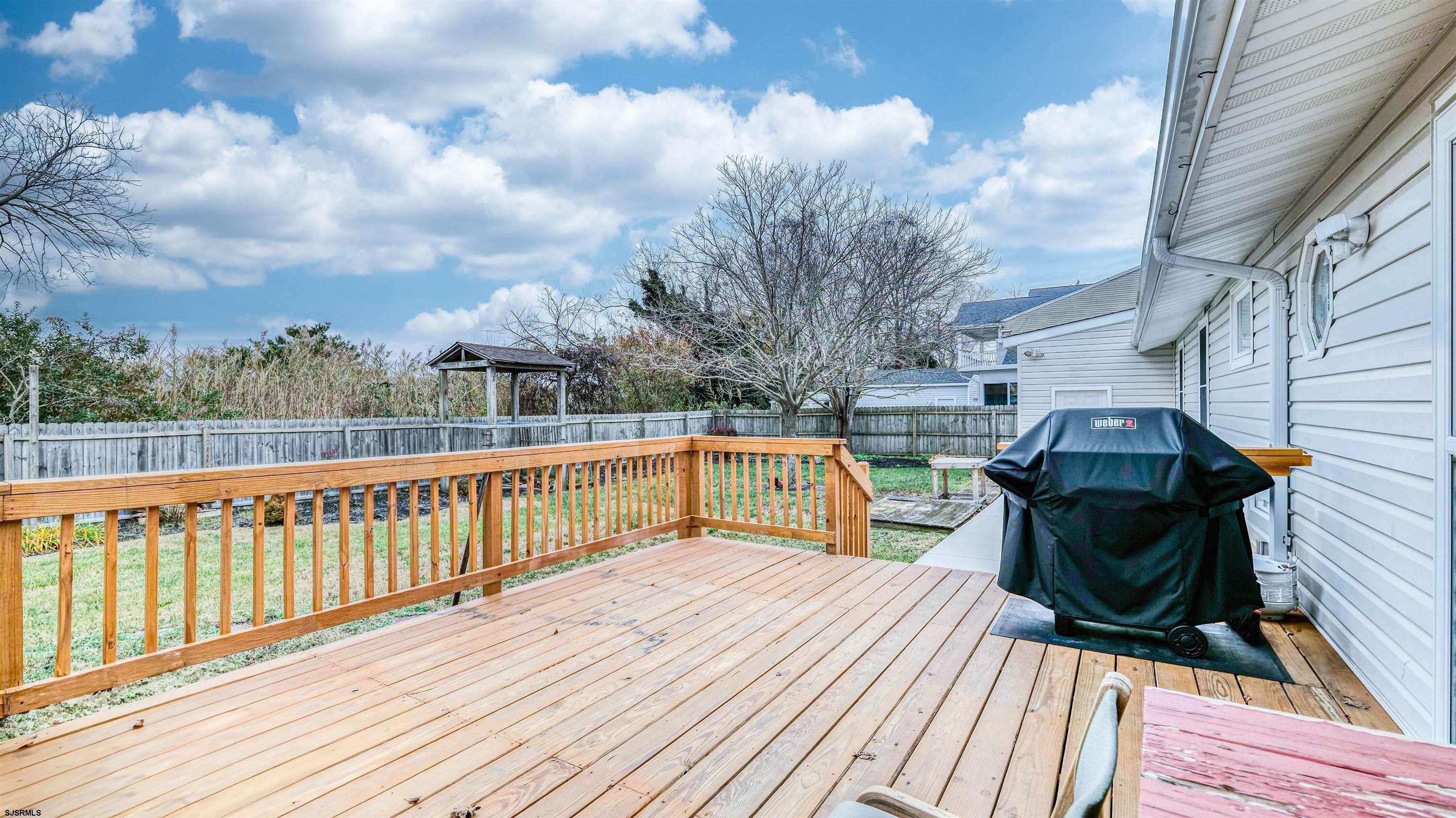 715 Lafayette Boulevard Brigantine, NJ 08203 - Photo 22 of 31 a view of roof deck with wooden floor and fence