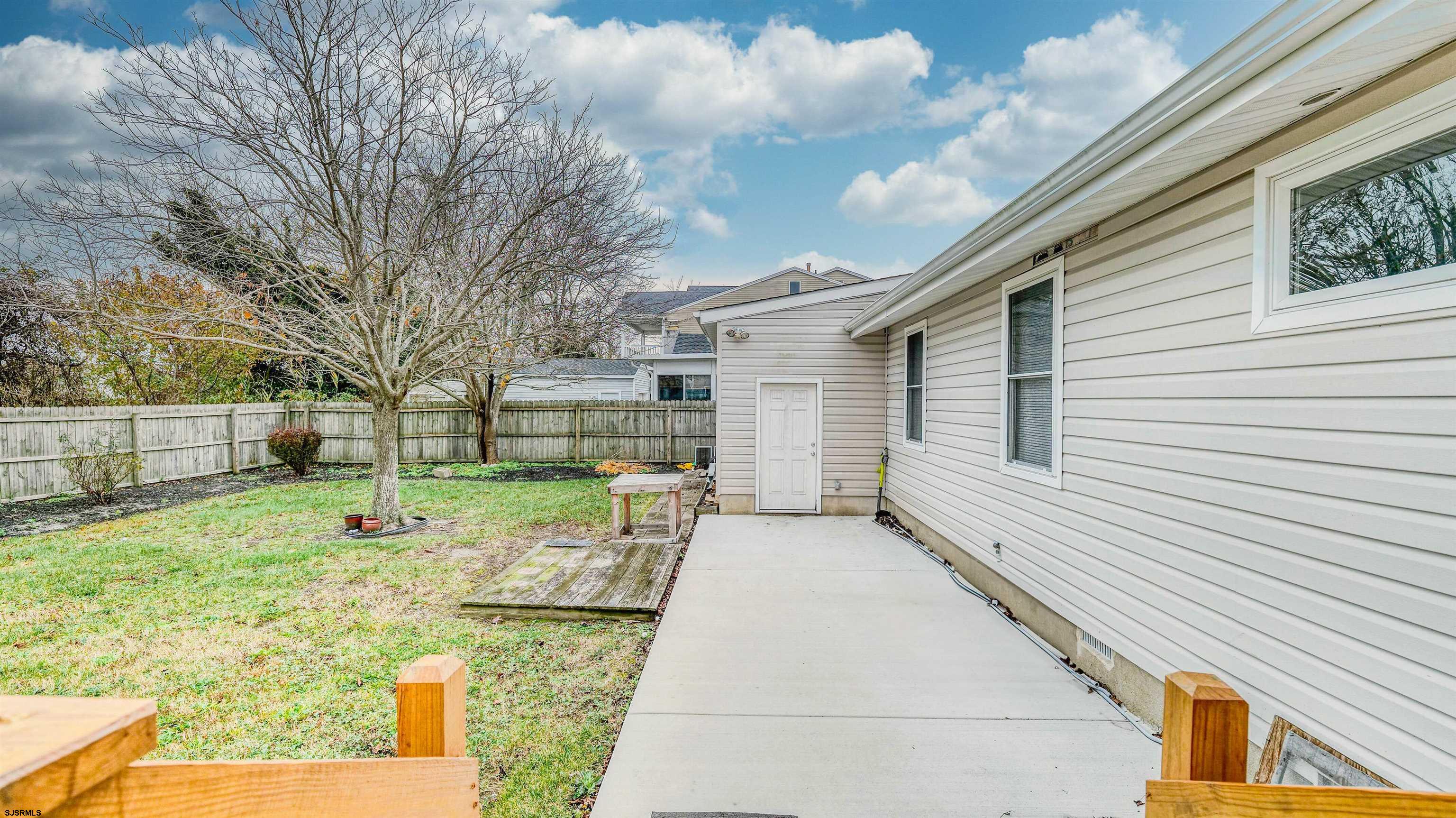 715 Lafayette Boulevard Brigantine, NJ 08203 - Photo 24 of 31 a backyard of a house with seating space