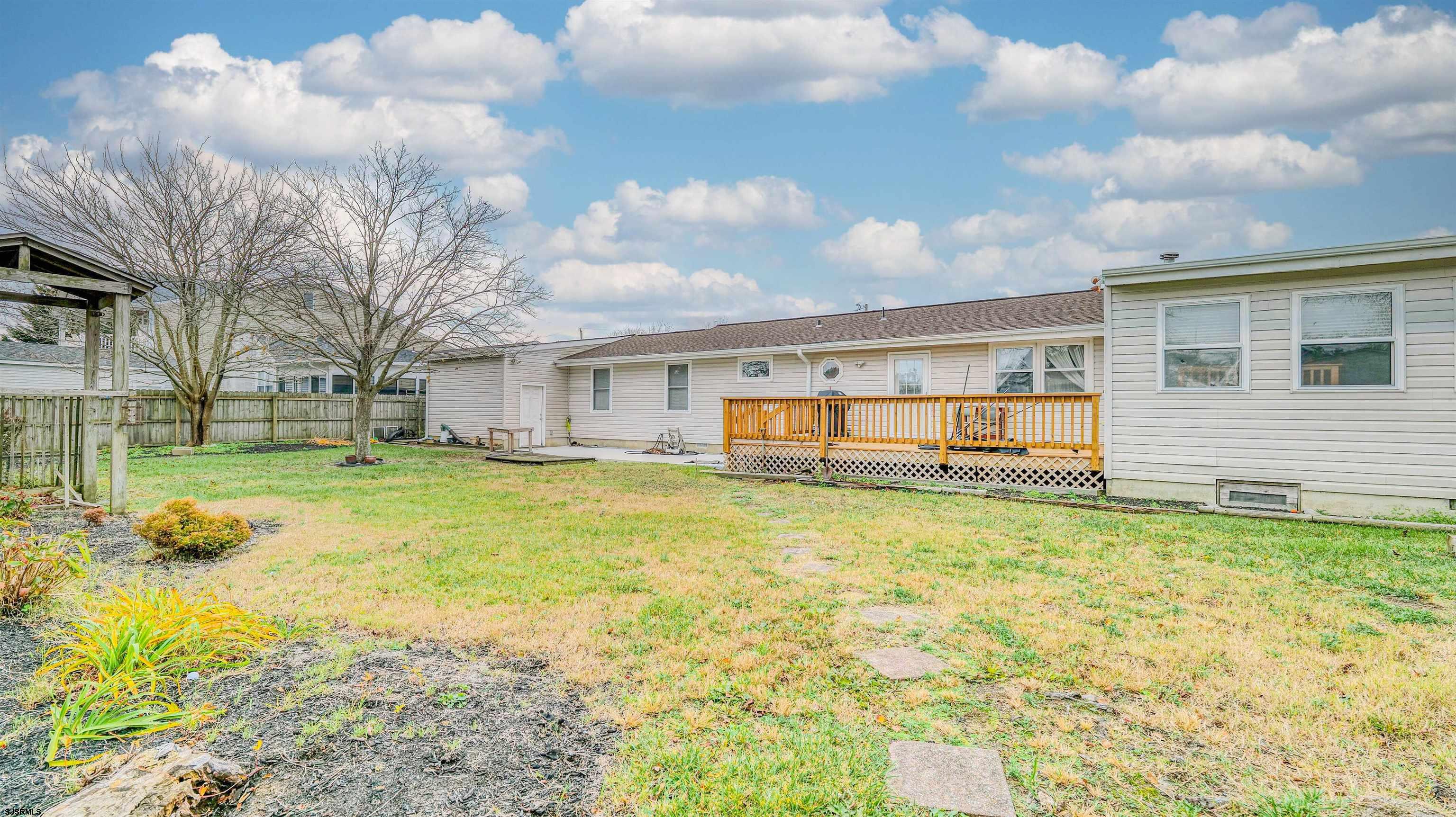 715 Lafayette Boulevard Brigantine, NJ 08203 - Photo 26 of 31 a view of a house with a backyard
