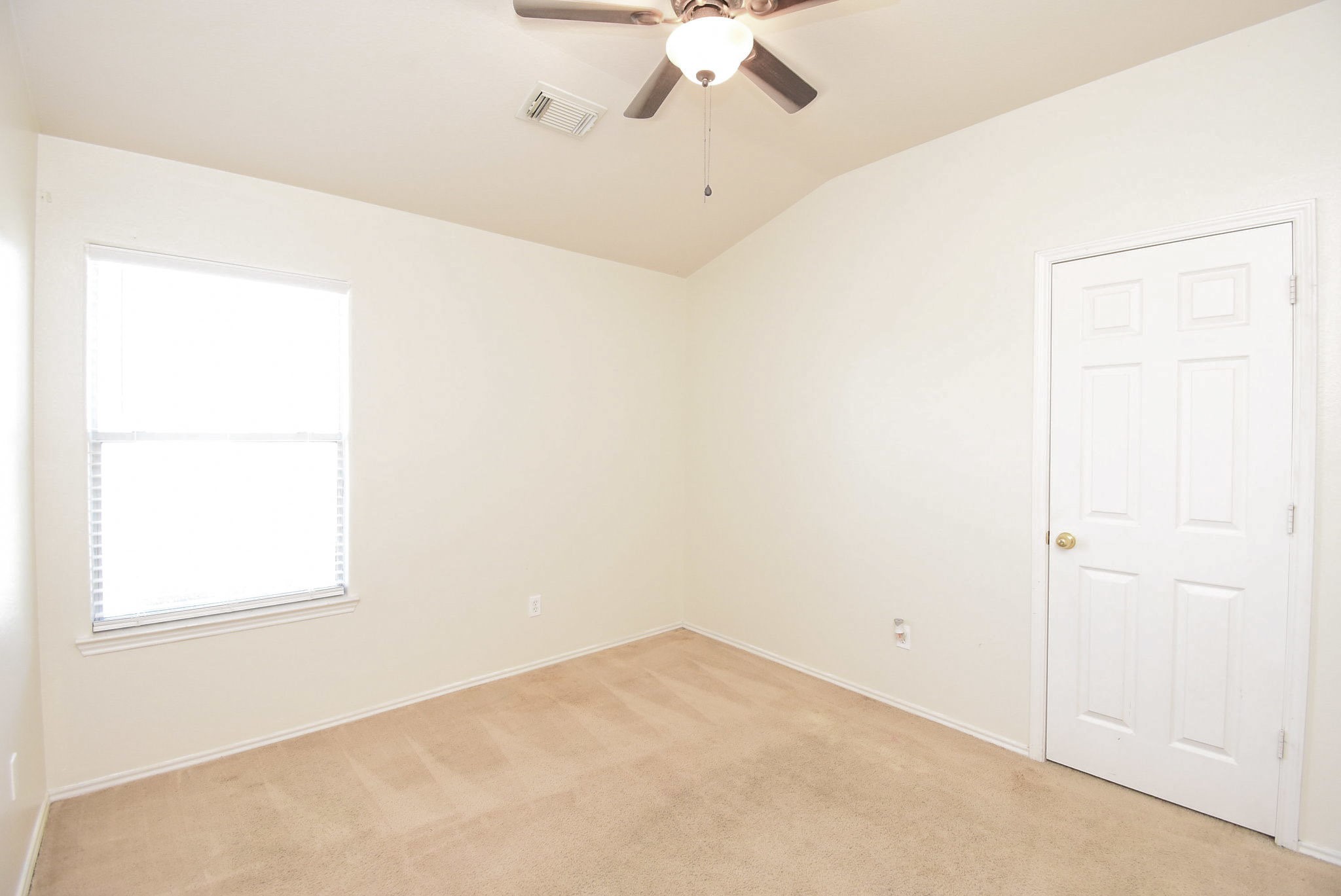 8502 Parapet Place Rosharon, TX 77583 - Photo 23 of 34 an empty room with a window and a fan